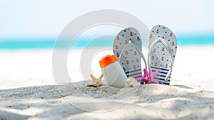 Protective sunscreen or sunblock and sunbath lotion for healthy care skin woman in white plastic bottles with starfish on tropical