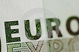 Protective watermark on a hundred euro bill in macro. protection against counterfeiting of banknotes. hologram. detail of paper