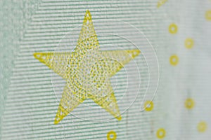 Protective watermark on a hundred euro bill in macro. protection against counterfeiting of banknotes. hologram. detail of paper