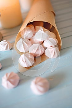 Protein based dessert. White and pink marshmallows in paper cone