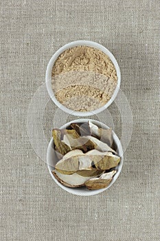 Protein powder with dried mushrooms - vegan ingredient - in a bowl from above flat