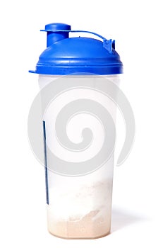 Protein shaker with blue top and whey powder photo