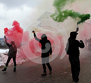 Protest with protesters wearing black gloves