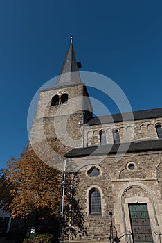 Protestant church with tower in Hilden before blue sky