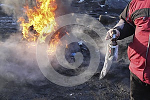 Protester with Molotov cocktail at Euromaidan in Kyiv, Ukraine