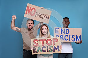 Protesters demonstrating different anti racism slogans on light blue background. People holding signs with phrases