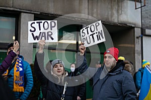 Protesters Holding Up a Stop War Sign and a Stop Putin Sign at an Anti War Protest in front of the United Nations in New York City
