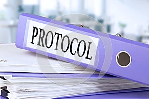 Protocol, text written in a folder with documents in trendy purple color, lying on a stack of papers, documents on an office table