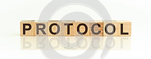 Protocol word made with building blocks on a light background