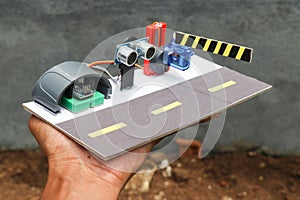 Prototype of automatic toll gate system using ultrasonic sensor sensor and servo with programmable micro controller