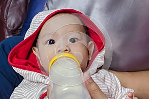 Protrait of baby boy, feeding