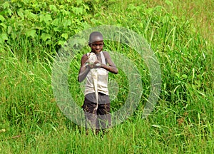 Proud African boy catches fish to feed family