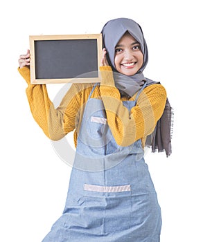 Proud asian cafe owner holding blank sign blackboard