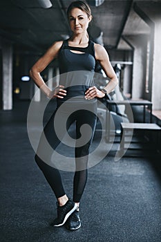 Proud of the body Ive worked for. Full length portrait of an attractive young woman standing with her hands on her hips