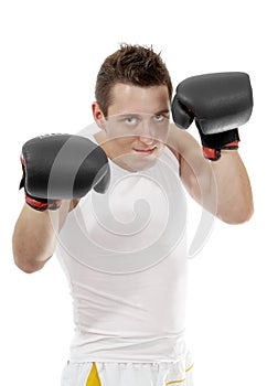 Proud boxer with boxing gloves after fight