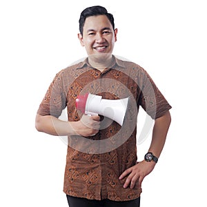 Proud Businessman Wearing Batik Shirt with Megaphone on Hand