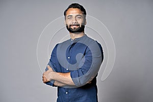 Proud confident indian business man isolated on gray, headshot portrait.