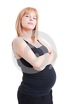 Proud and confident eight months pregnant woman