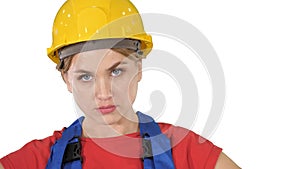 Proud confident young woman worker with arms on hips on white background.