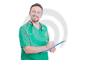 Proud and confindet doctor or medic using clipboard