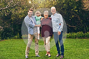 Proud of the family we created. Shot of a multigenerational family outside.