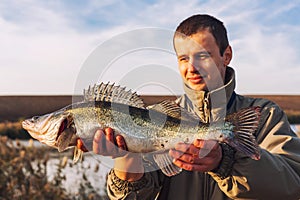 Proud fisherman with catch