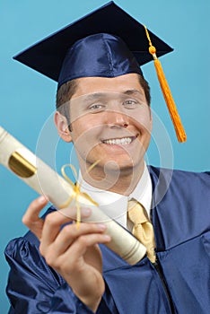 Proud graduate with diploma