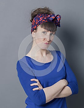Proud grumpy woman disagreeing and acting vexed with arms folded