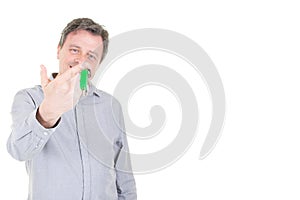 Proud handsome man home owner holding house keys with copy space