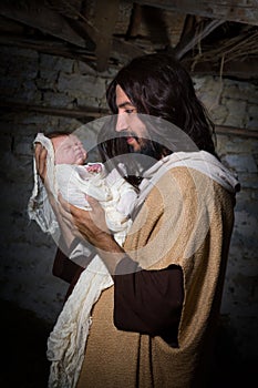 Proud Joseph with baby Jesus