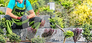 Proud Landscaper Sitting in His Garden