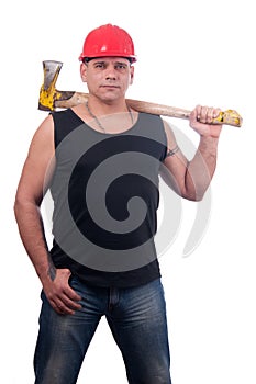 Proud lumberjack posing with ax on his shoulder