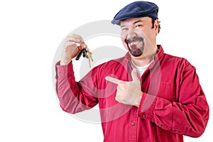 Proud man pointing to his new car keys