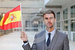 Proud man waving the Spanish flag