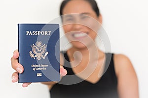 Proud new American citizen holding a US passport. Immigration