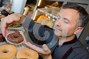 Proud pastry chef in confectionnery