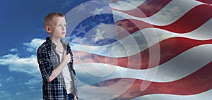 Proud Patriotic kid looks at American flag