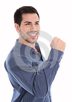 Proud and successful young business man making fist gesture isol