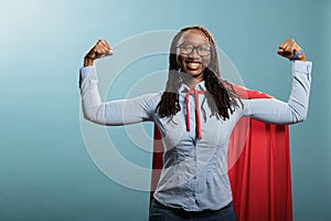 Proud and tough looking young adult superhero woman showing empowerement and braveness.