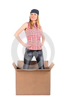 Proud woman standing in a cardboard box