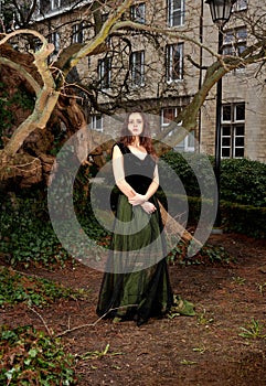 Proud woman in Victorian outfit in the park