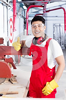 Proud worker at his workplace in industrial plant
