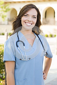 Proud Young Adult Female Doctor or Nurse Portrait Outside