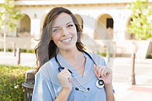 Proud Young Adult Woman Doctor or Nurse Portrait Outside