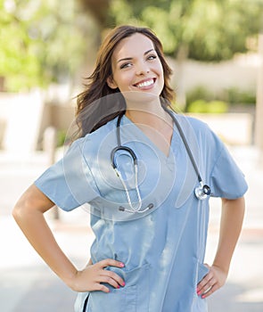 Proud Young Adult Woman Doctor or Nurse Portrait Outside