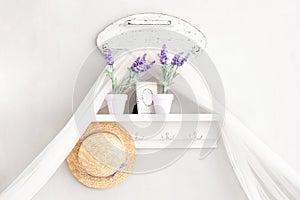 Provence, rustic style. Shabby chic in Provencal style. Village, country house. Shelf for hats, household trifles in a gentle Fren