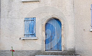 Provence style blue wooden doors and window shutters