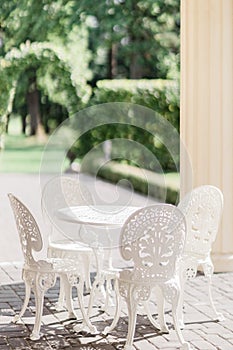 White table with chairs in the patio