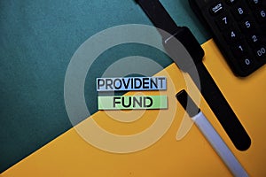 Provident Fund text on top view color table background photo