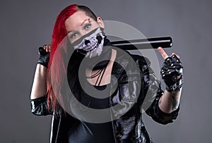 Provoking woman with bandana and baseball bat
